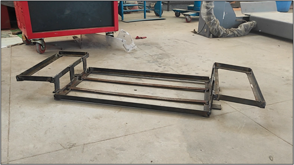 Photograph of the custom fabricated battery boxes installed in the vehicle chassis